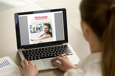 Woman with laptop displaying the Apple Health booklet