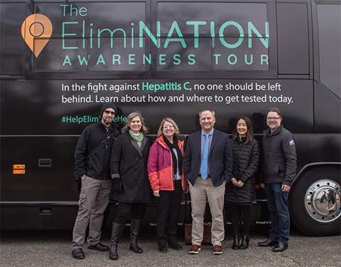 HCA Director, Sue Birch with Chief Medical Office, Dr. Judy Zerzan and staff outside The Elimination Awareness Tour bus