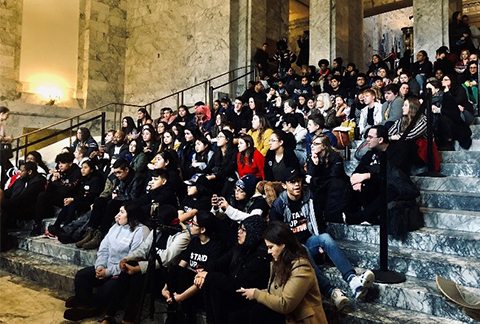 Youth sitting in the legislative room at the state capitol for Prevention Policy Day