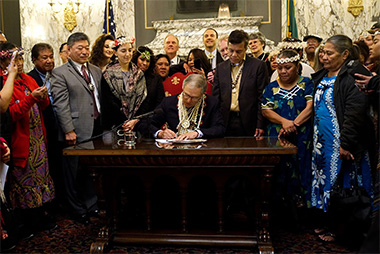 COFA islanders and Governor Inslee at health care signing ceremony