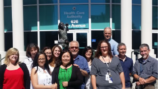 OMEP staff in front of HCA fountain