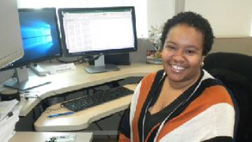 Miranda Boyd sitting at her desk